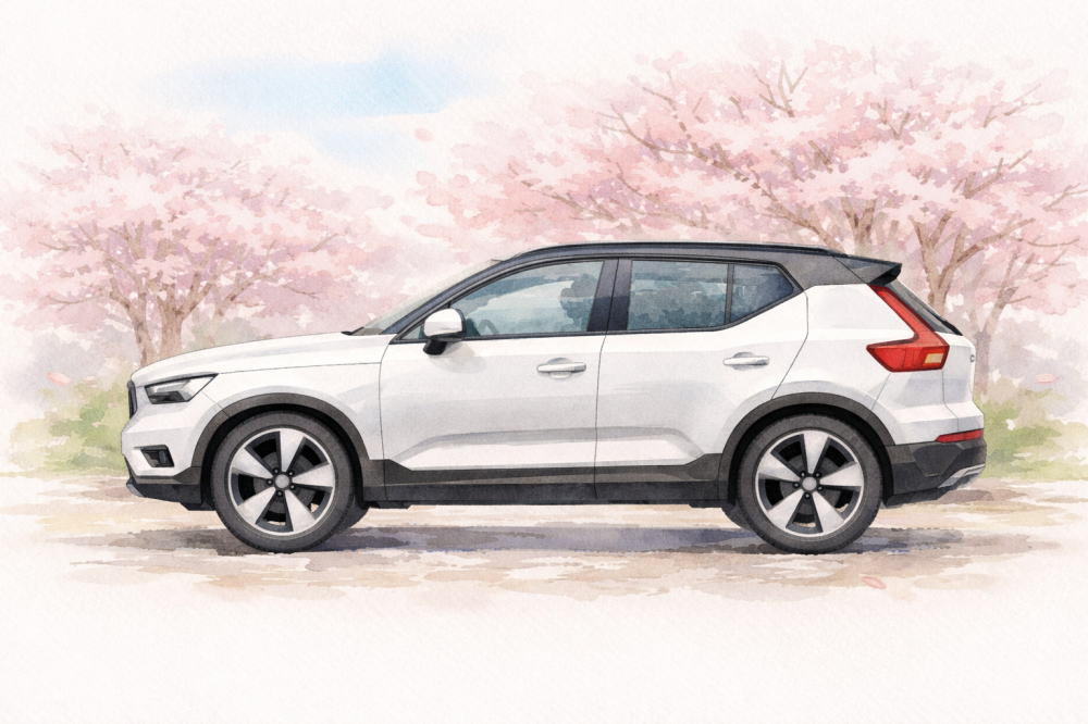 「ボルボXC40の中古はなぜ安い」を解説する記事用イメージ画像。桜並木と北欧デザイン車風水彩イラスト。